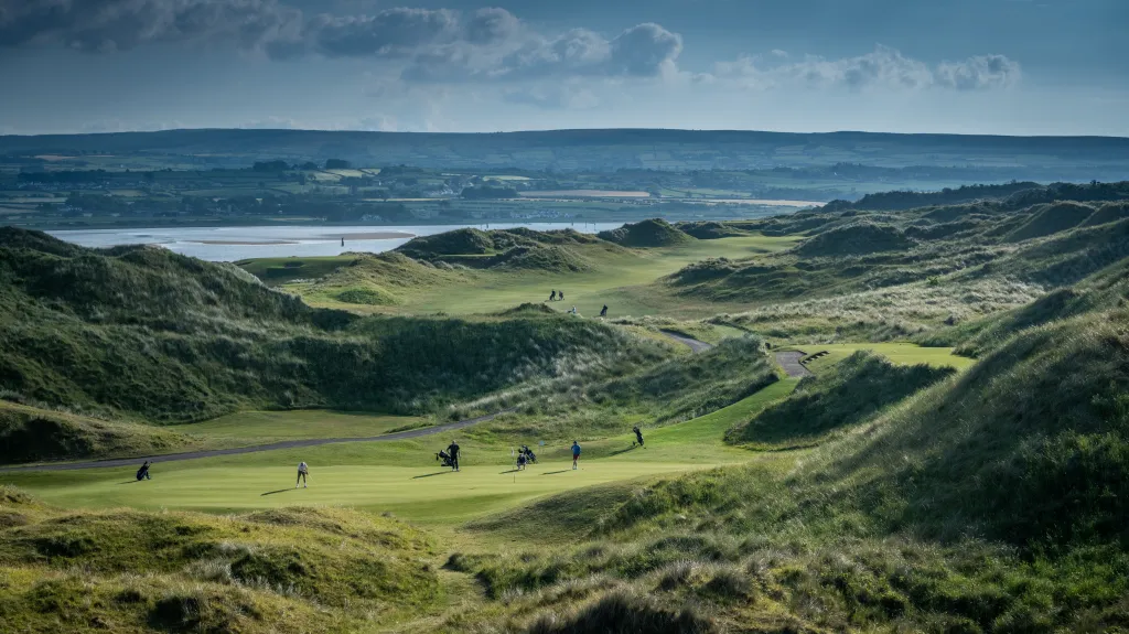Dunes and fairways running down towards the estuary